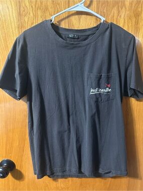 Black Short-Sleeve Pocket Tee - "Just Breathe" decal on pocket.